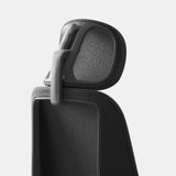 Close-up of the Ergonomic Novo Chair Headrest in onyx black, featuring an adjustable design with breathable mesh for enhanced neck support and posture alignment. A sleek and modern ergonomic upgrade.