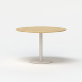 Urbanica round meeting table with light oak top and warm white pedestal base, clean product view