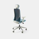 Urbanica Ergonomic Muse Chair Headrest shown from the back, highlighting breathable mesh support, lumbar curve, and modern design in soft blue.