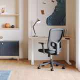 Urbanica Ergonomic Onyx Chair with breathable mesh back and adjustable armrests, styled in a minimalist home office setup for all-day comfort and posture support.