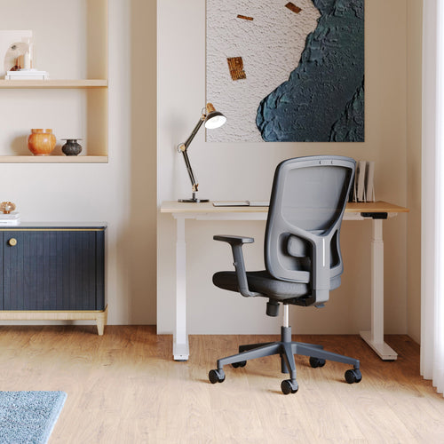 Urbanica Ergonomic Onyx Chair with breathable mesh back and adjustable armrests, styled in a minimalist home office setup for all-day comfort and posture support.